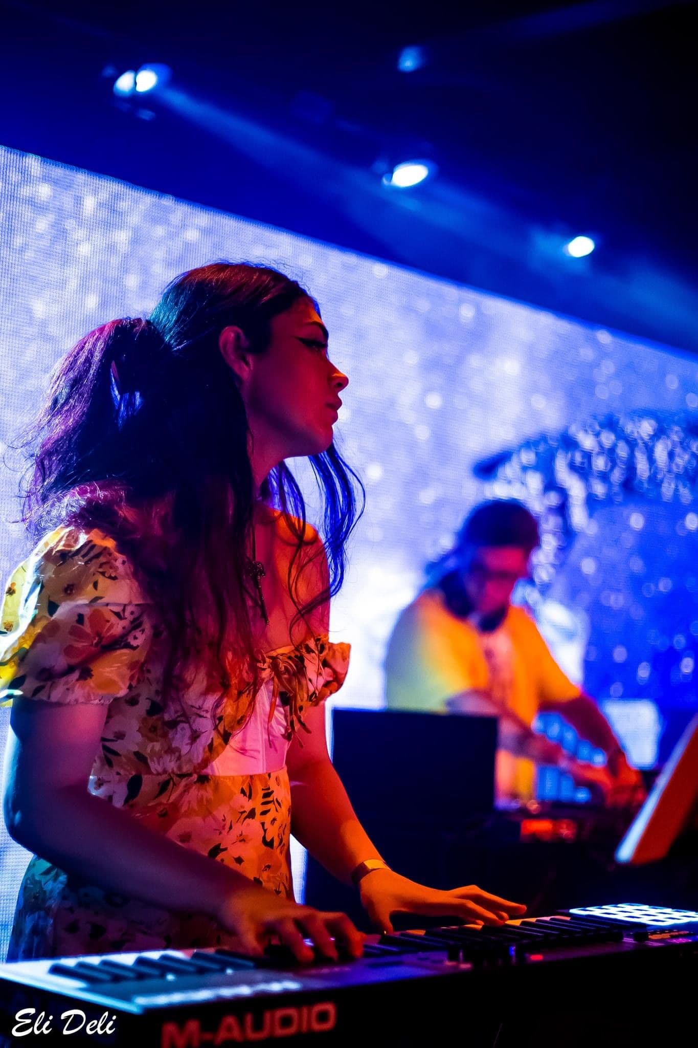 Alexandrina playing piano on stage